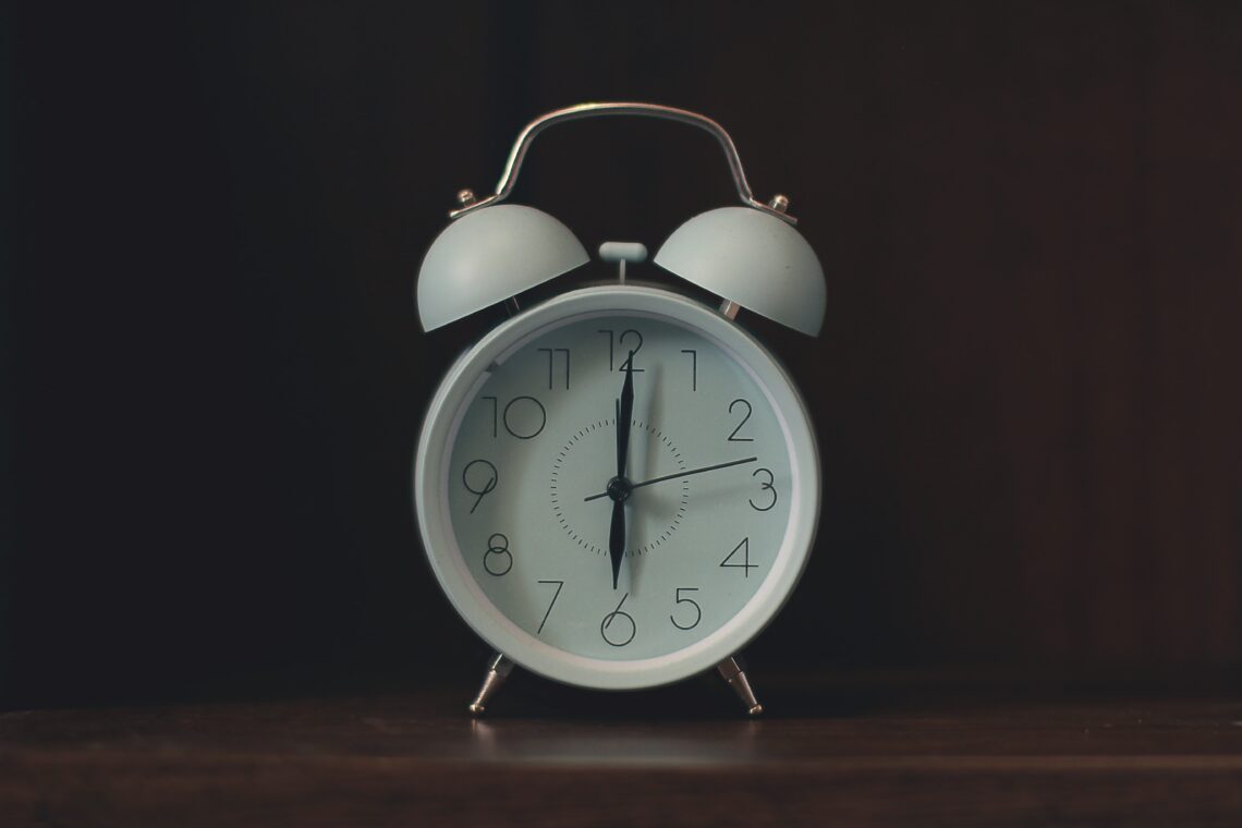 an alarm clock depicting six o'clock